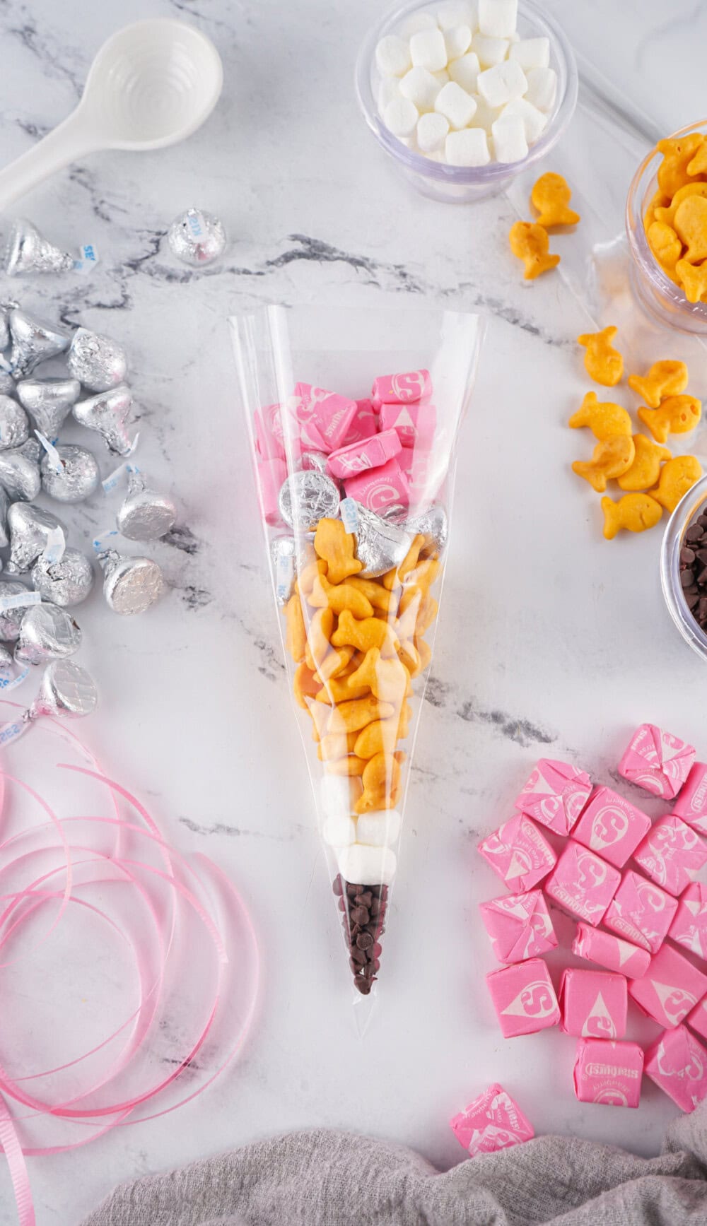 Topping cellophane treat bag with pink Starbursts. 