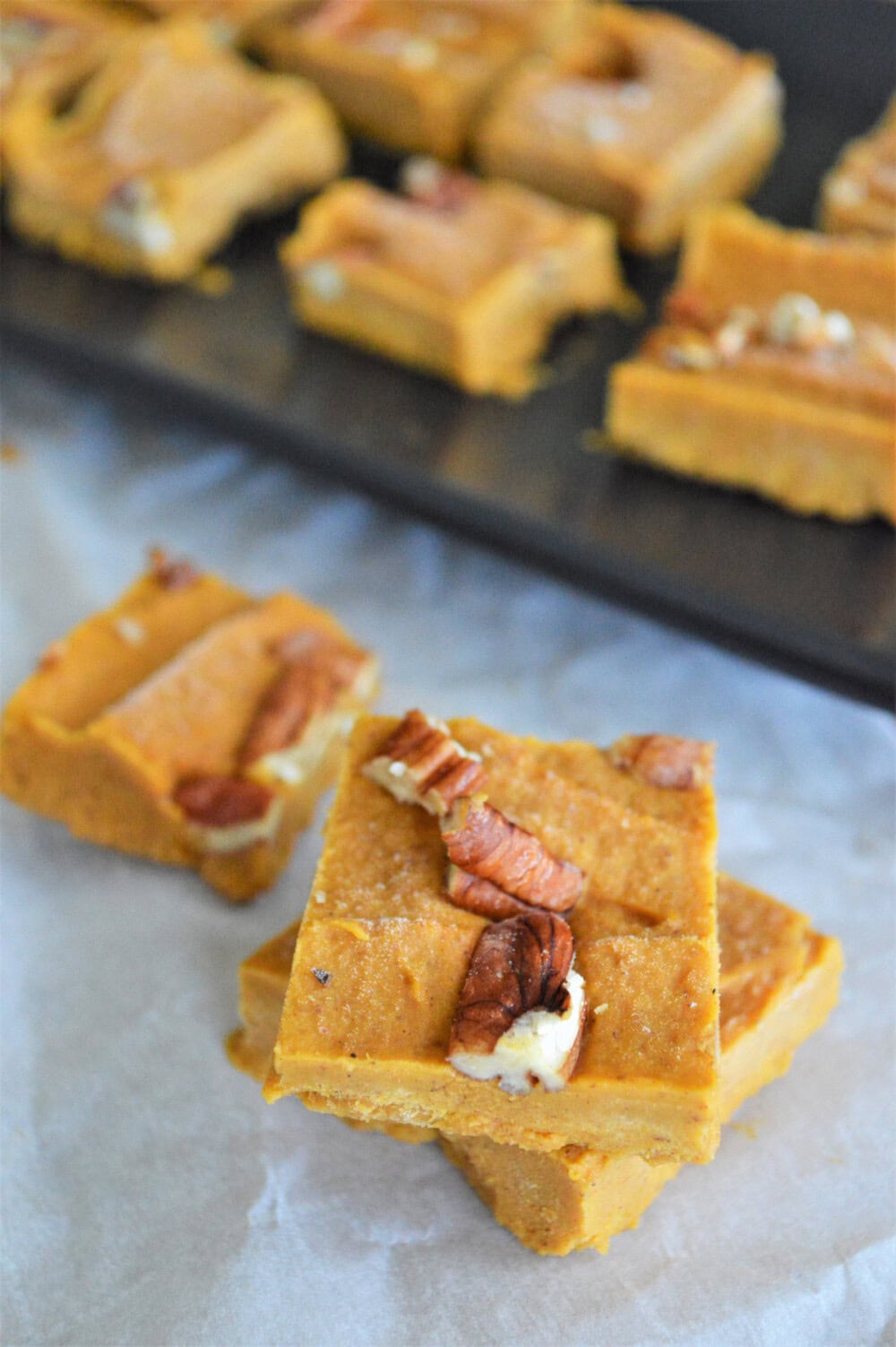 Pumpkin fudge topped with pecans. 