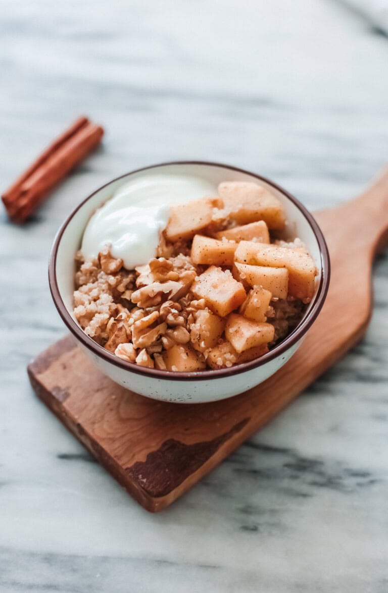 A bowl of quinoa with fruit and yogurt.