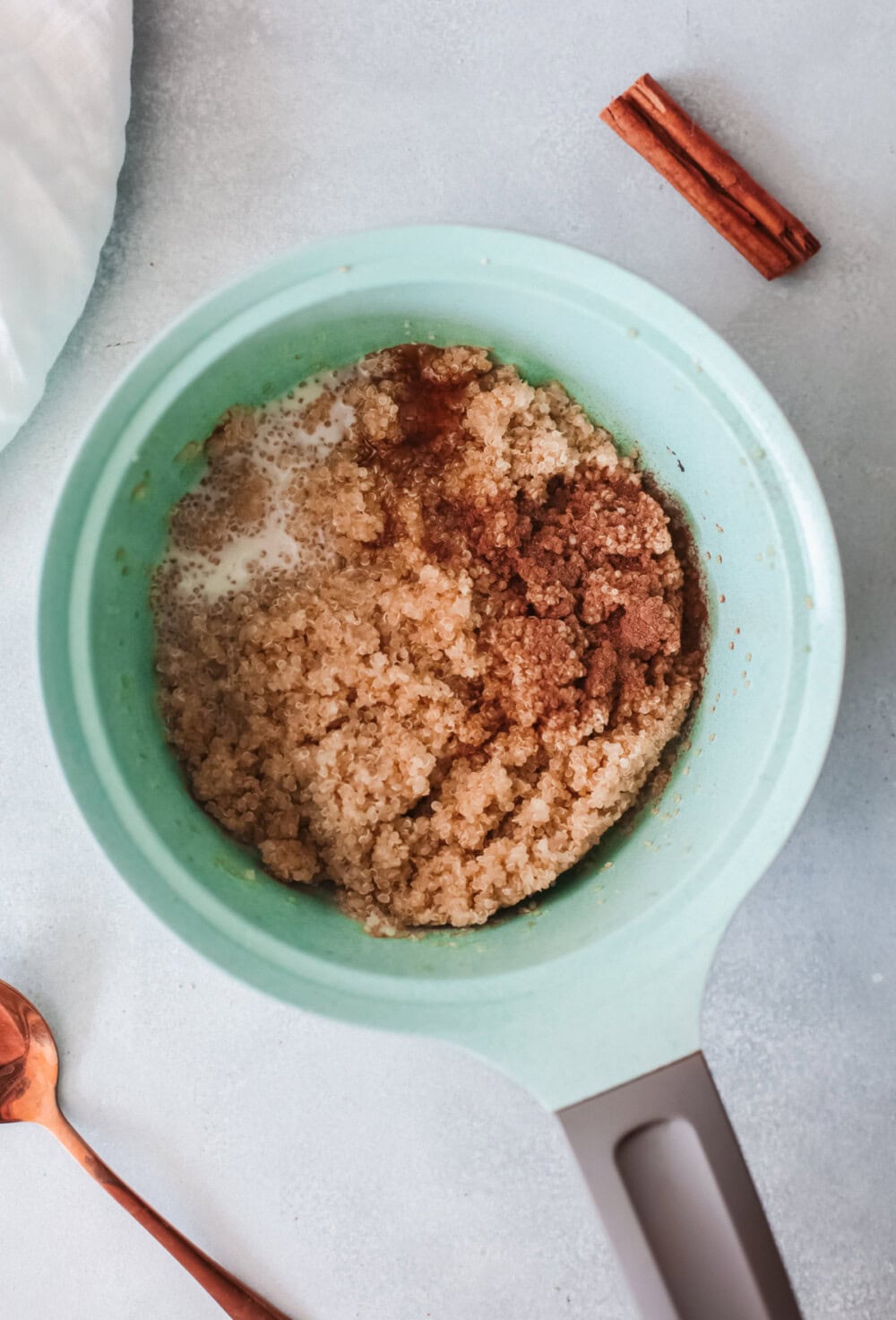 Quinoa and spices in a pan.