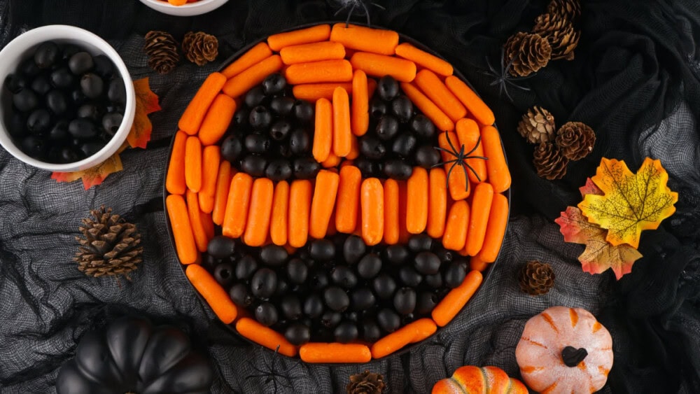 Halloween veggie tray that looks like a pumpkin face. 