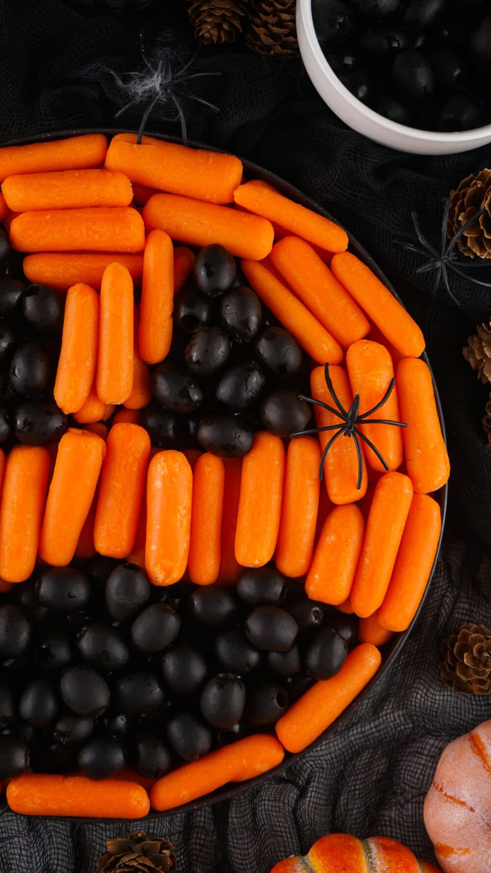 Pumpkin face carrot and olive platter. 