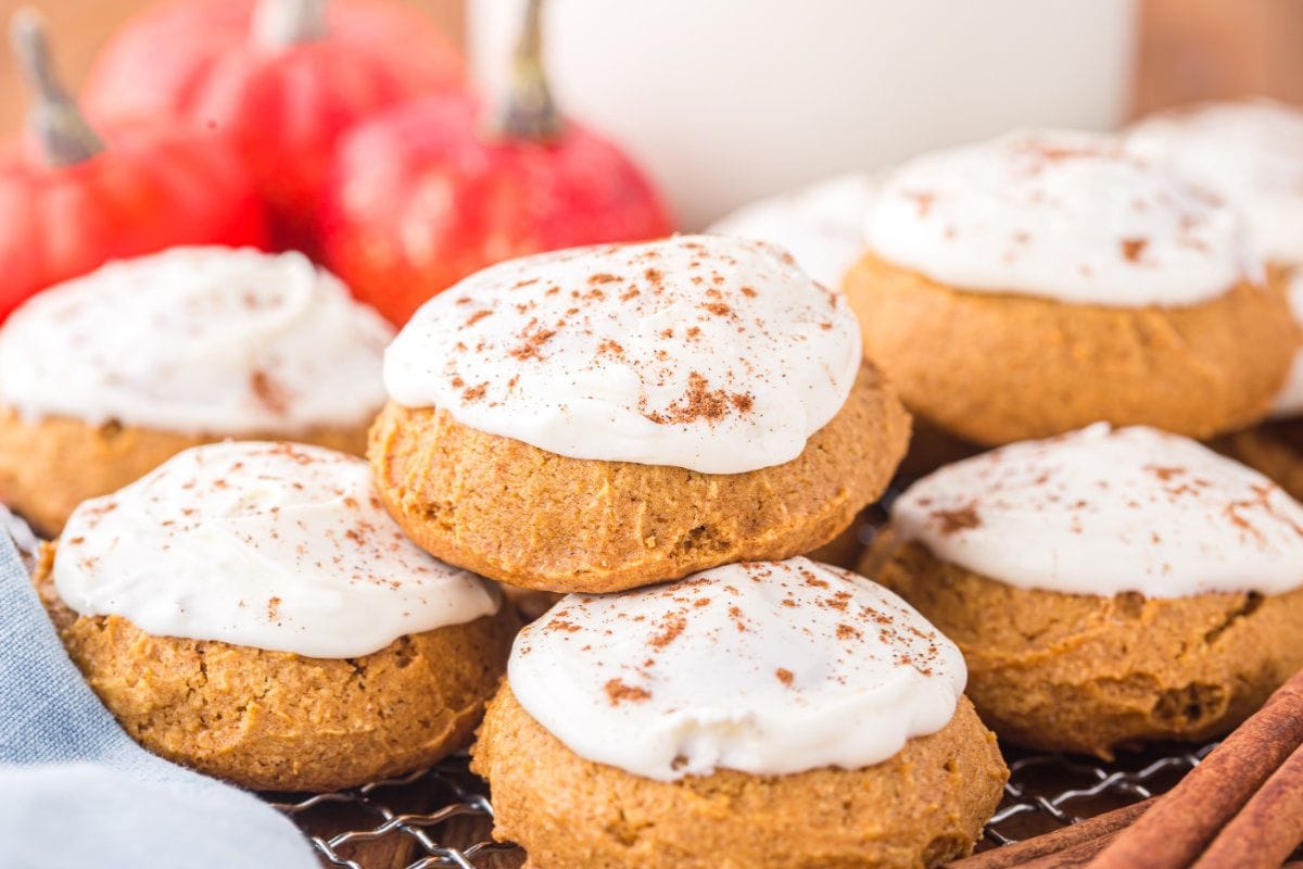 Frosting pumpkin cookies. 