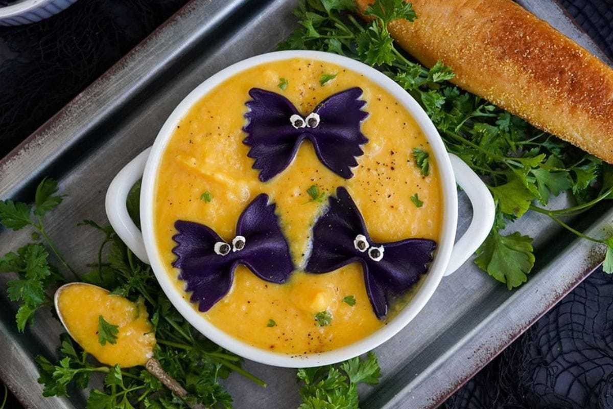 Butternut squash soup topped with bat pasta. 