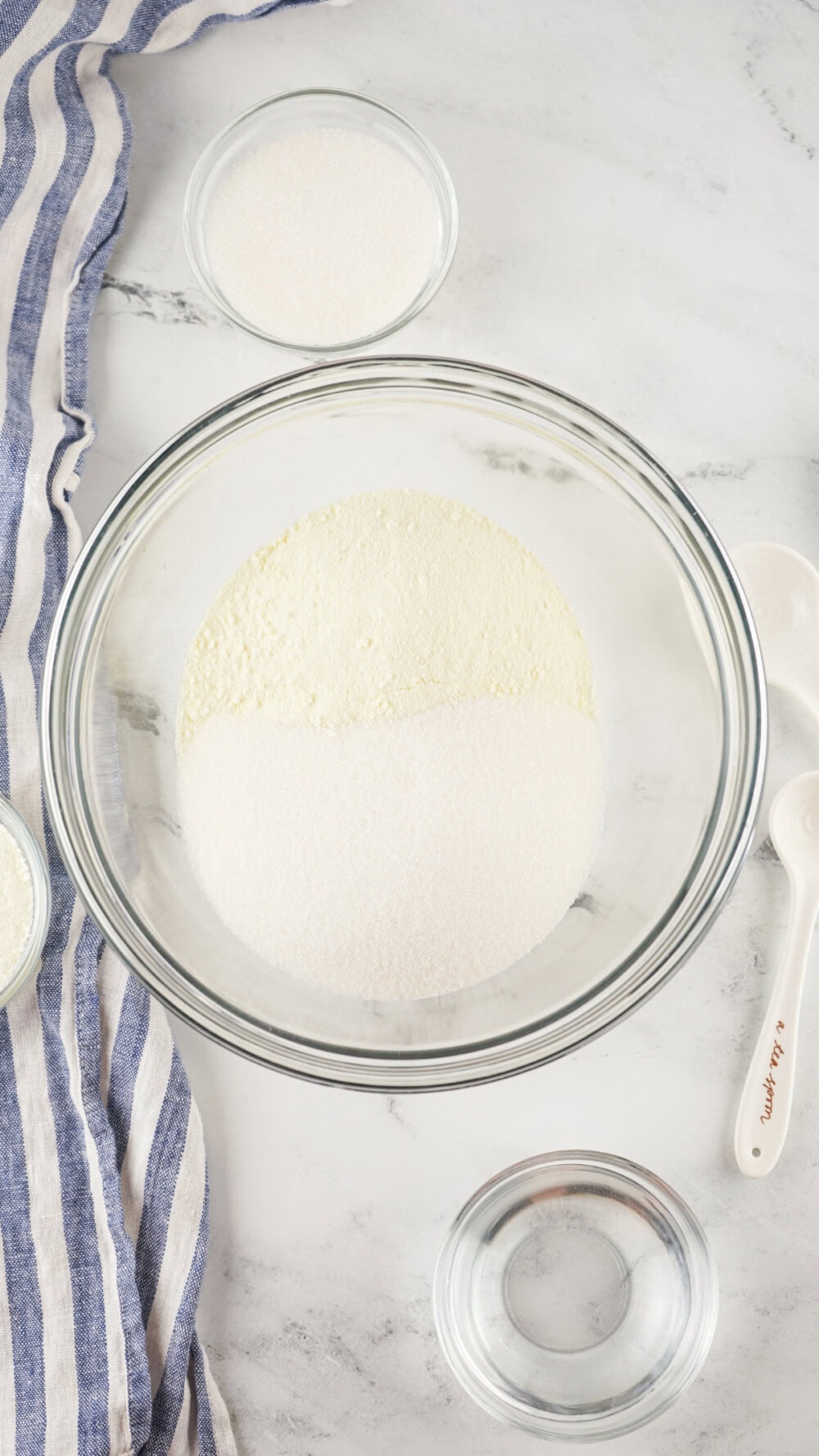 Powdered milk and sugar in a bowl. 