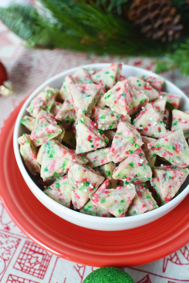 Bowl full of elf bites mini holiday shortbread cookies.