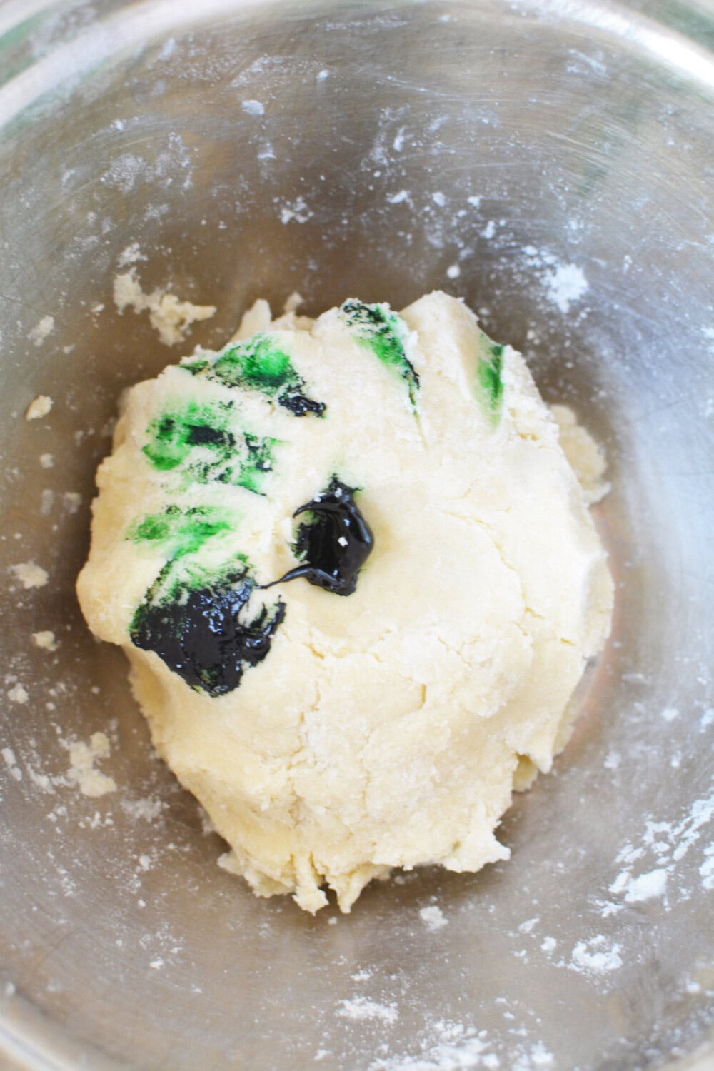 Green food coloring into shortbread dough ball.