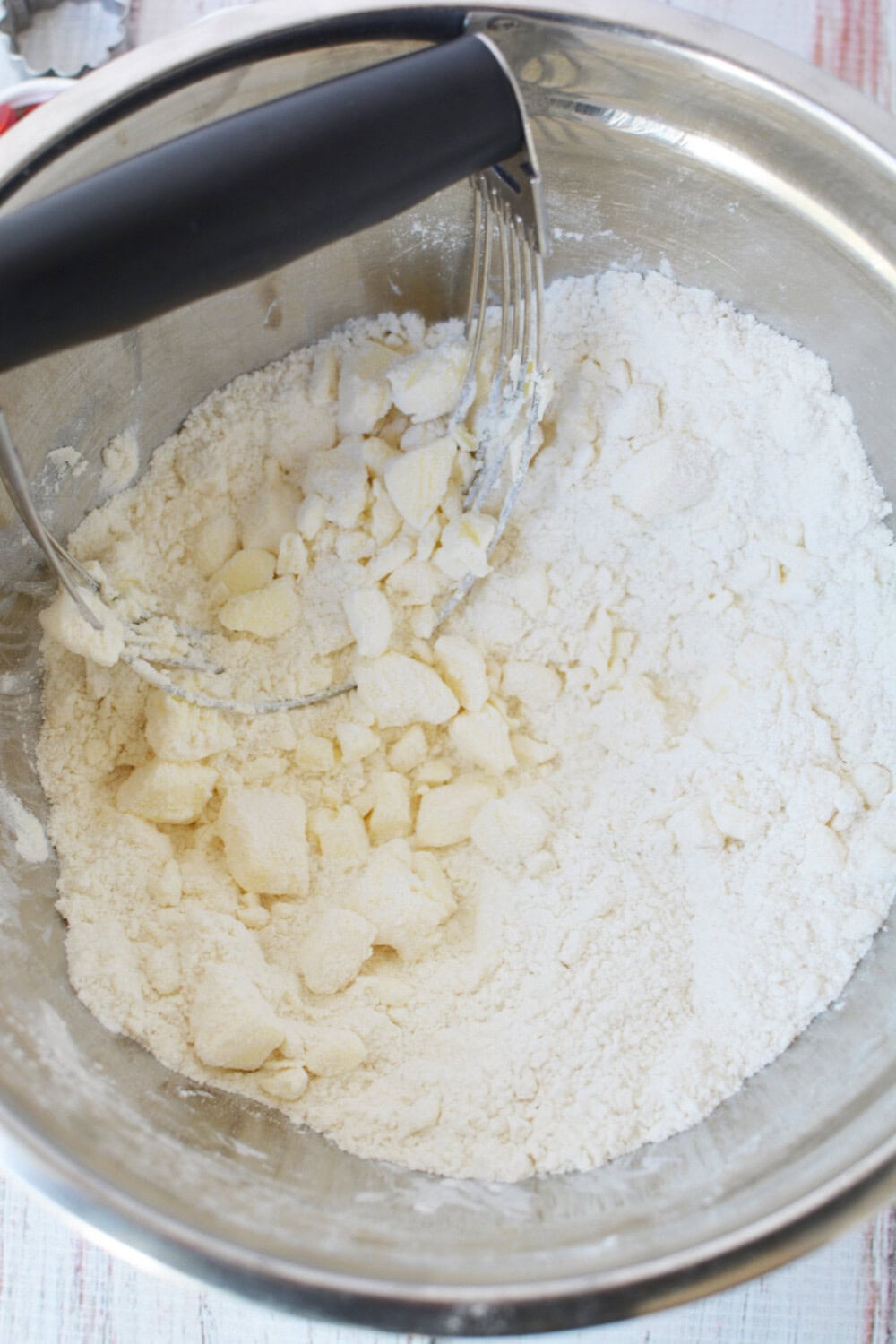 Butter mixing into flour and sugar mixture. 