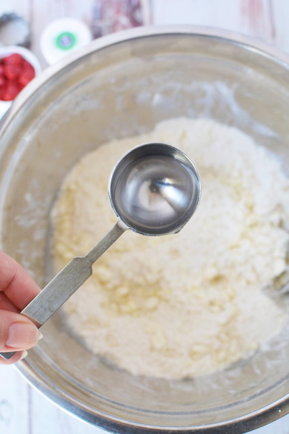 Water into dough mixture.