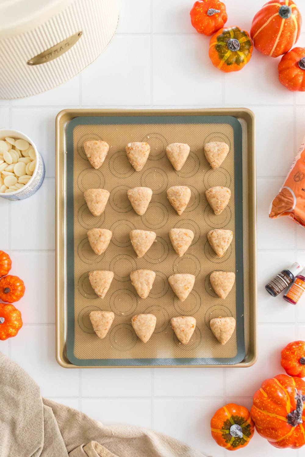 Cake mix dough shaped like pie slices on a baking sheet.