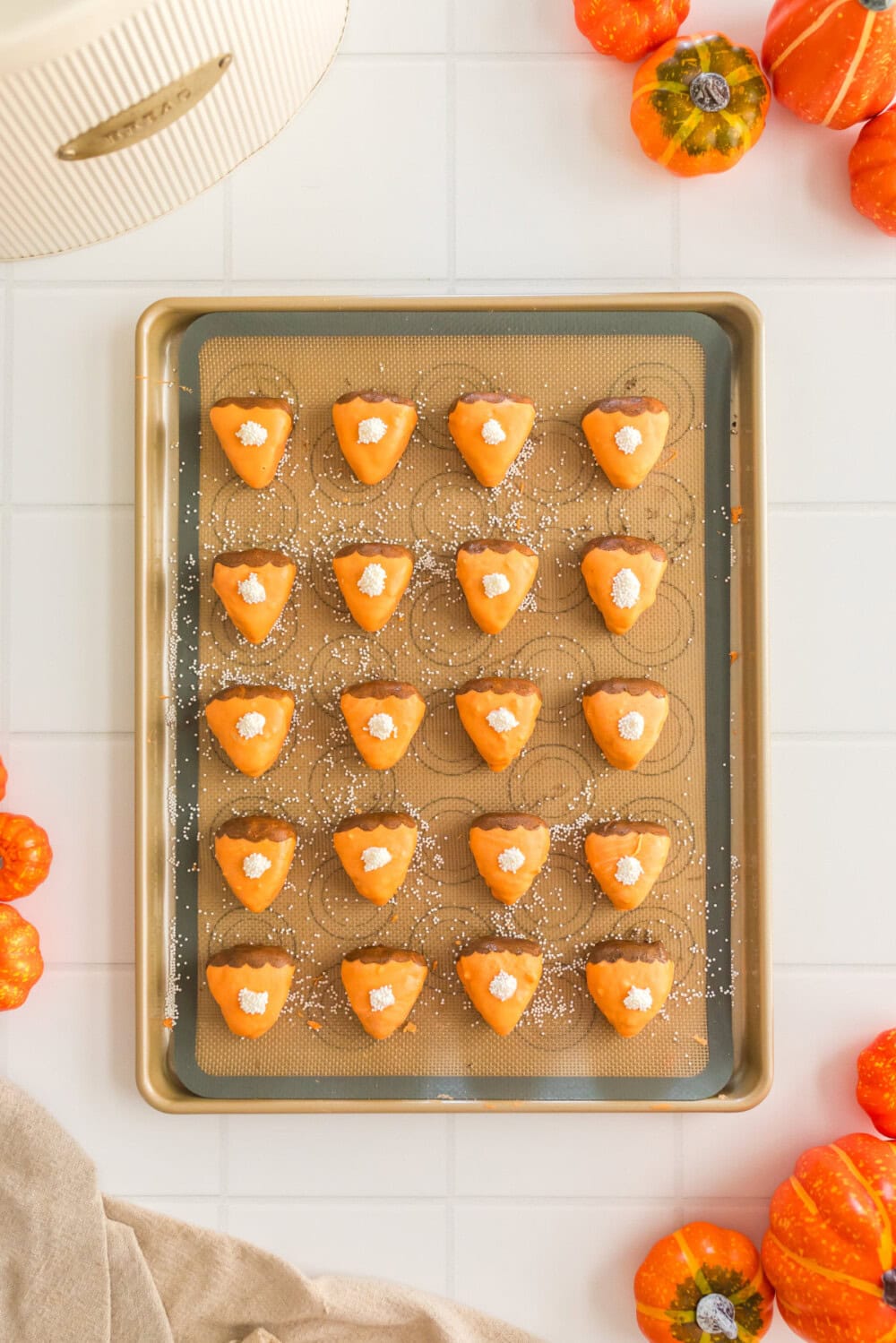 Cake bites decorated to look like little pumpkin pie slices.