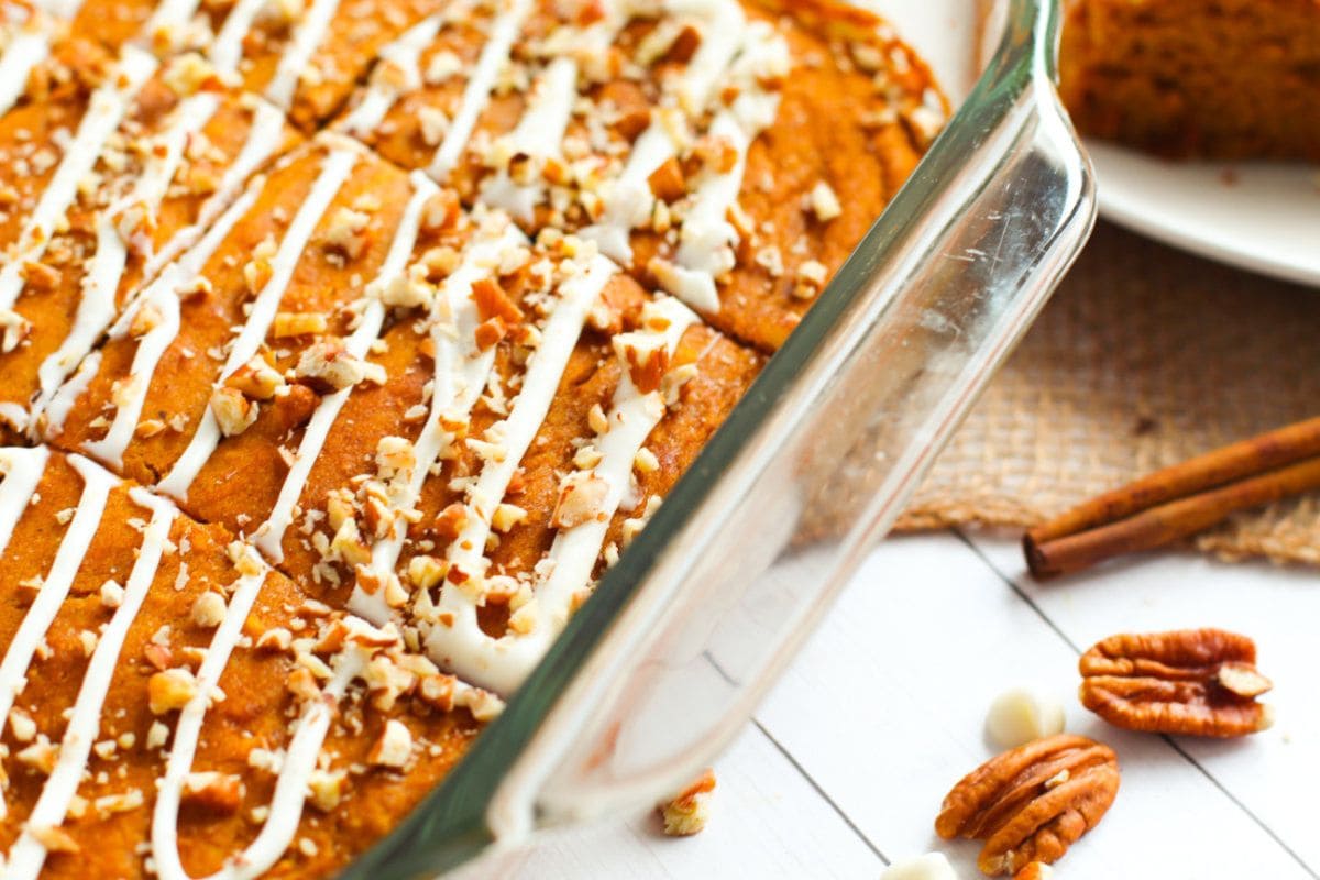 Baking dish full of pumpkin snack cake slices. 