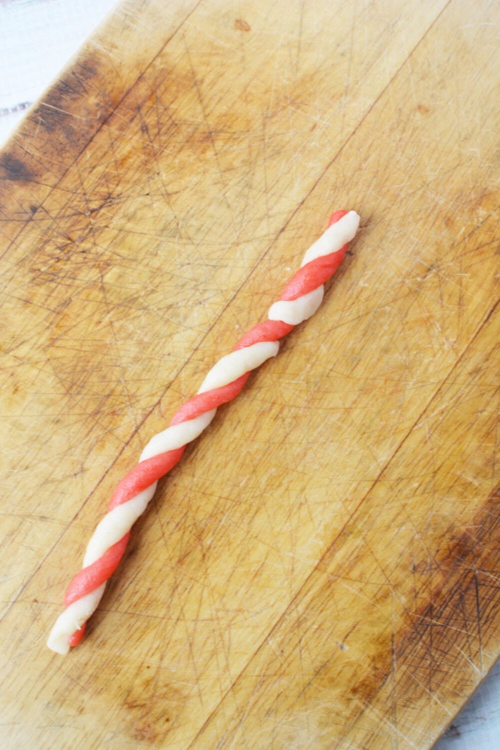 red and white cookie dough twisted together