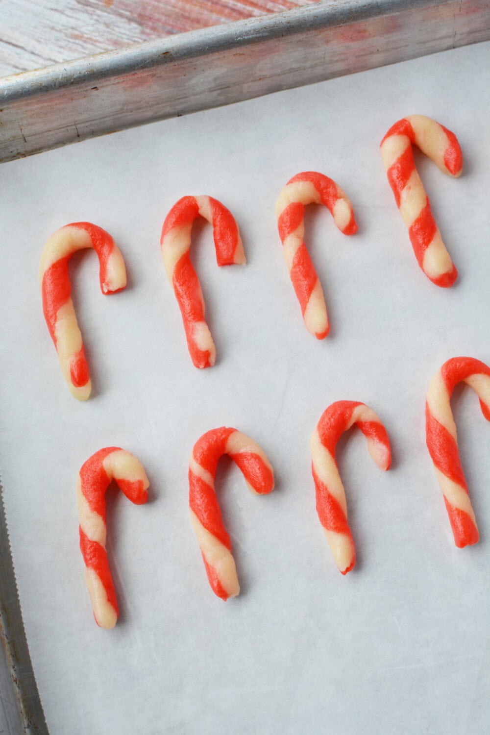 candy cane shortbread dough on a baking sheet