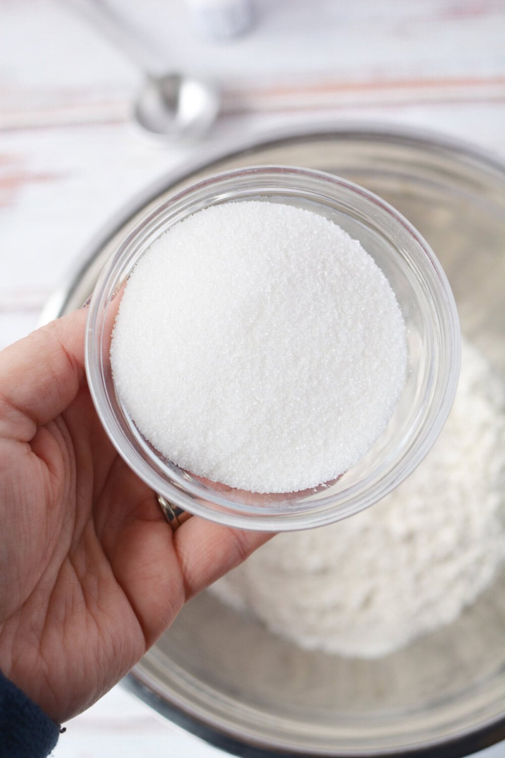 bowl of sugar above a mixing bowl