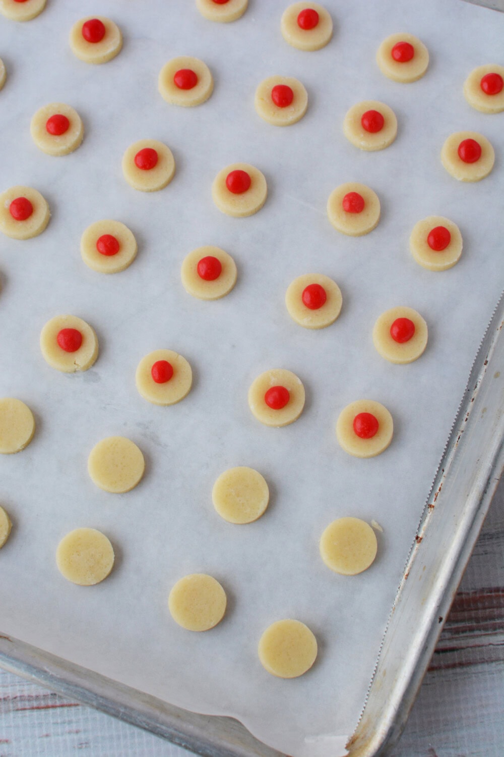 Cinnamon candies pressed into cookie dough