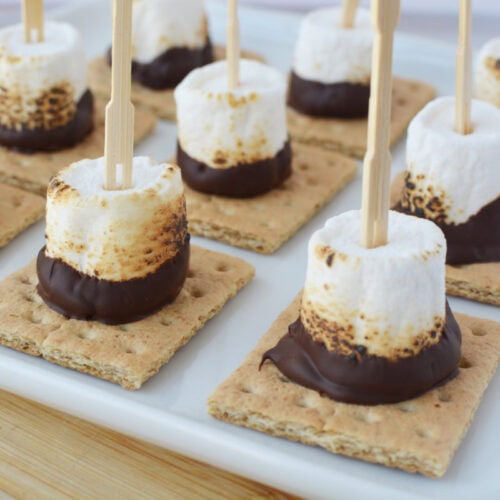 S'mores on a skewers on a serving tray.