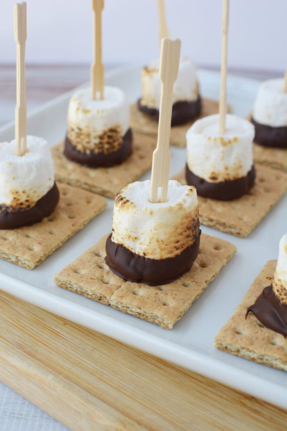 Skewered s'mores on a tray.