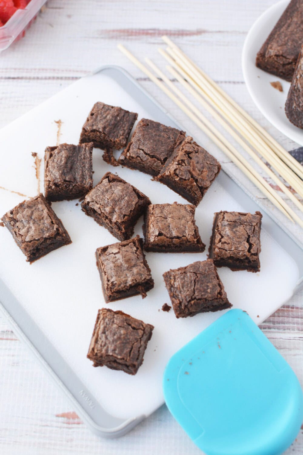 Squares of brownies on a cutting board.