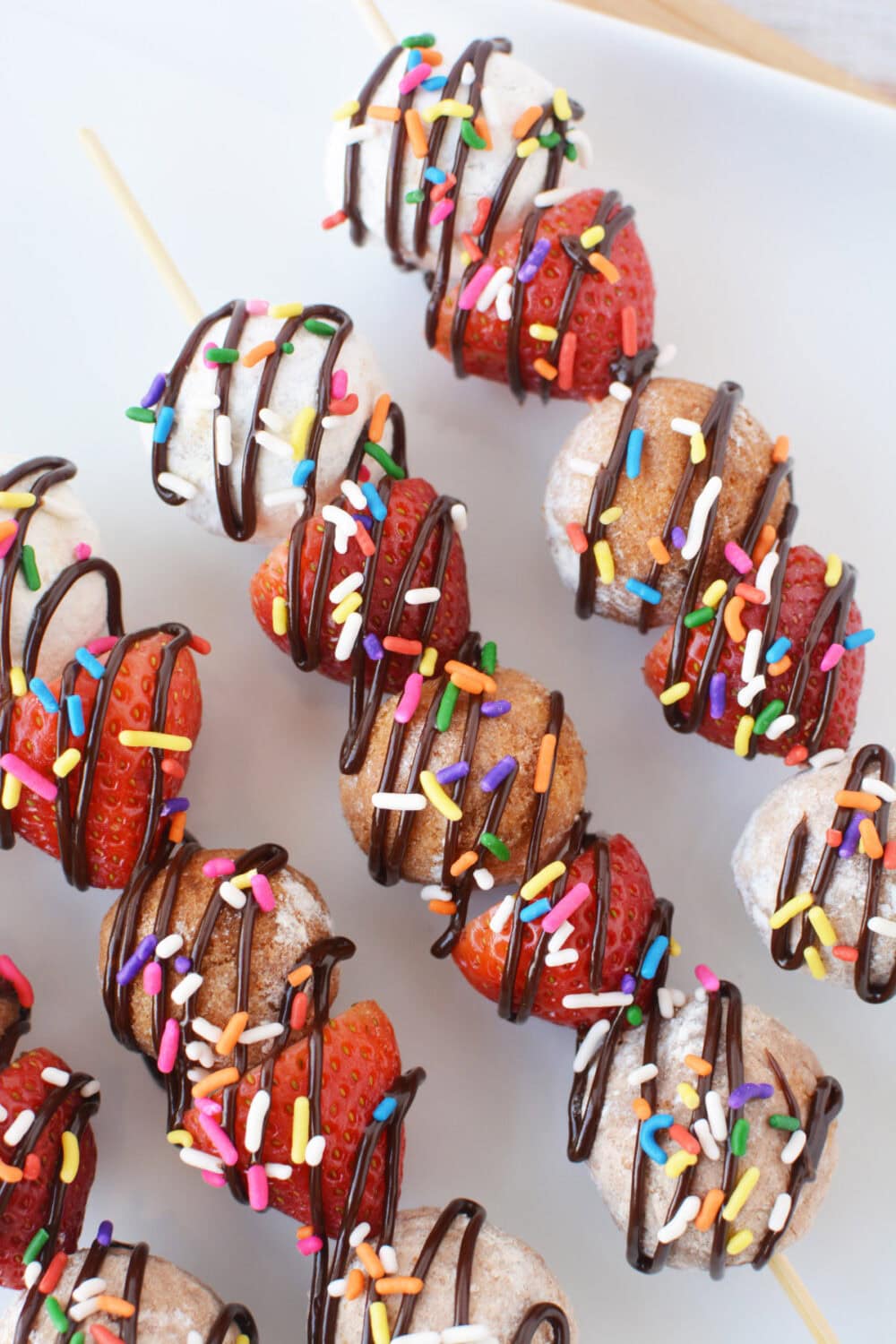 Donut skewers on a tray.