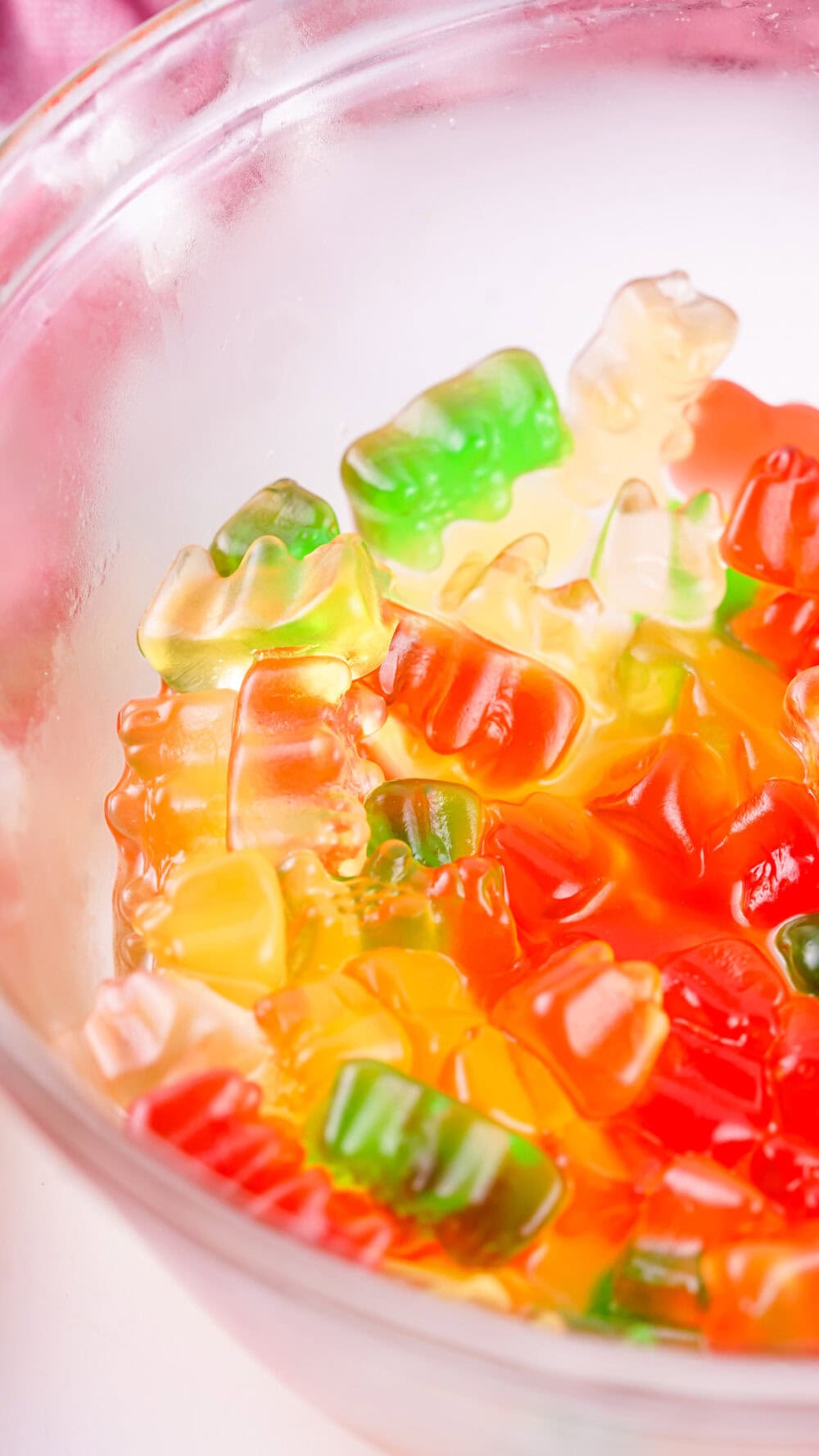 Bowl of sprite and gummy bears.