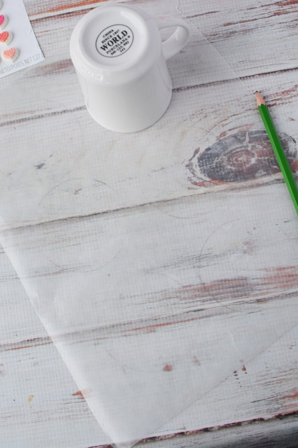 Tracing mug on parchment paper. 