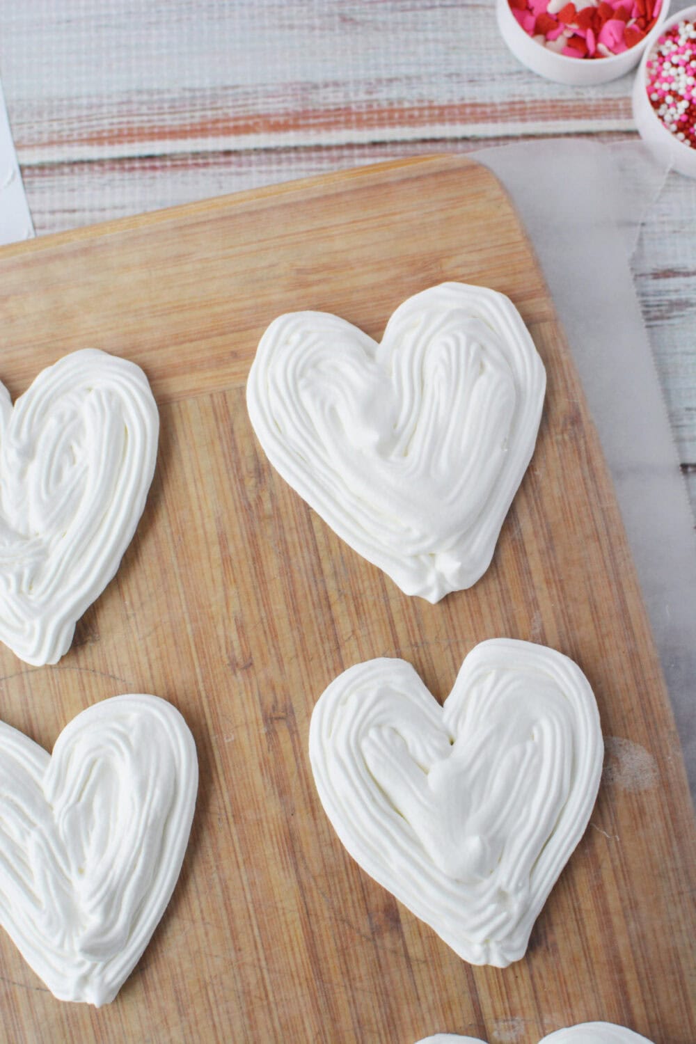 Filling in whipped cream hearts. 