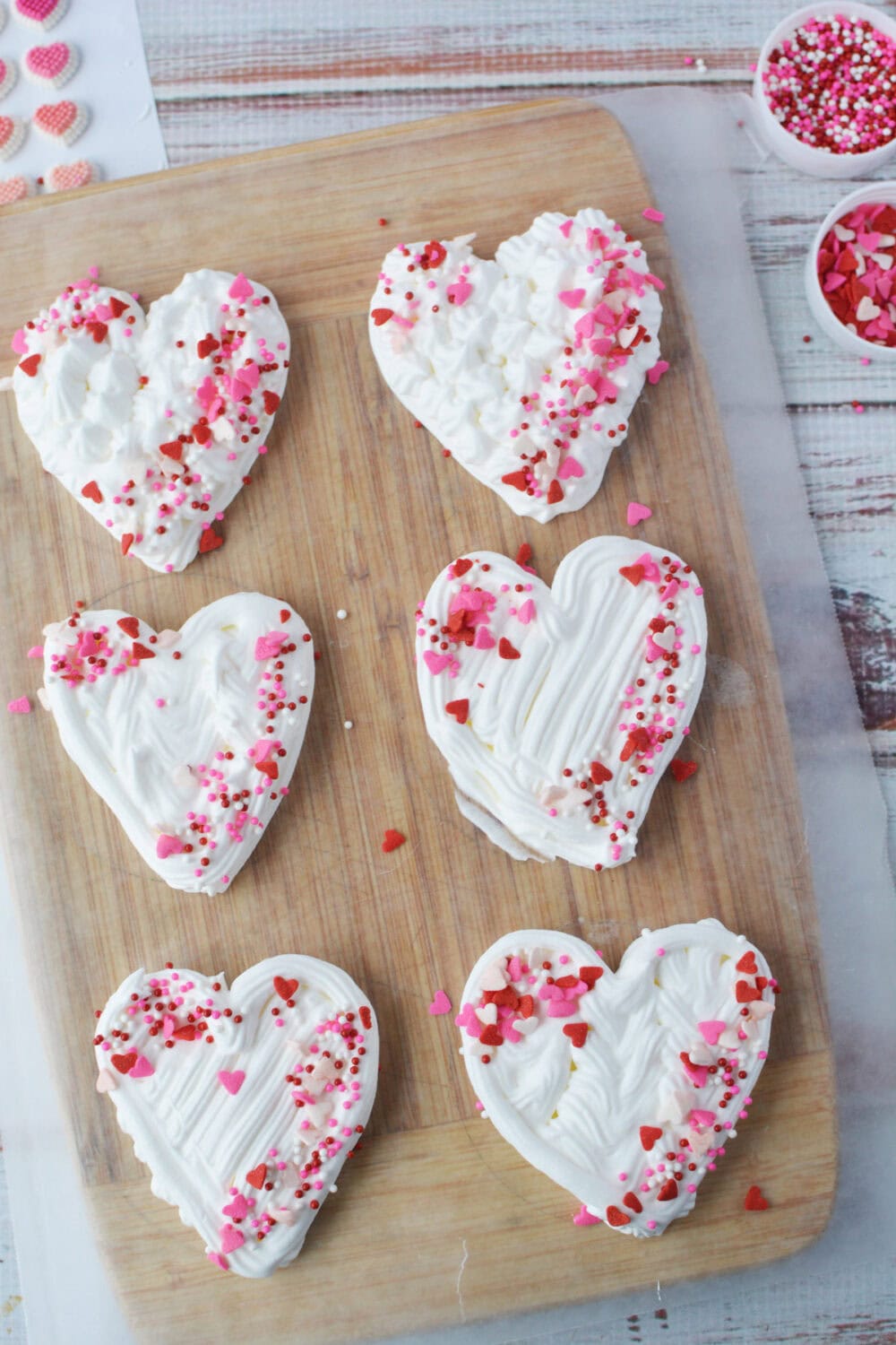 Valentine's Day sprinkles on whipped cream hearts. 