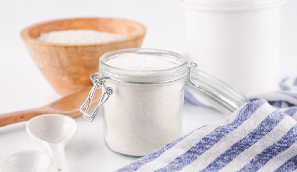 Rice flour in a bowl and in a container.