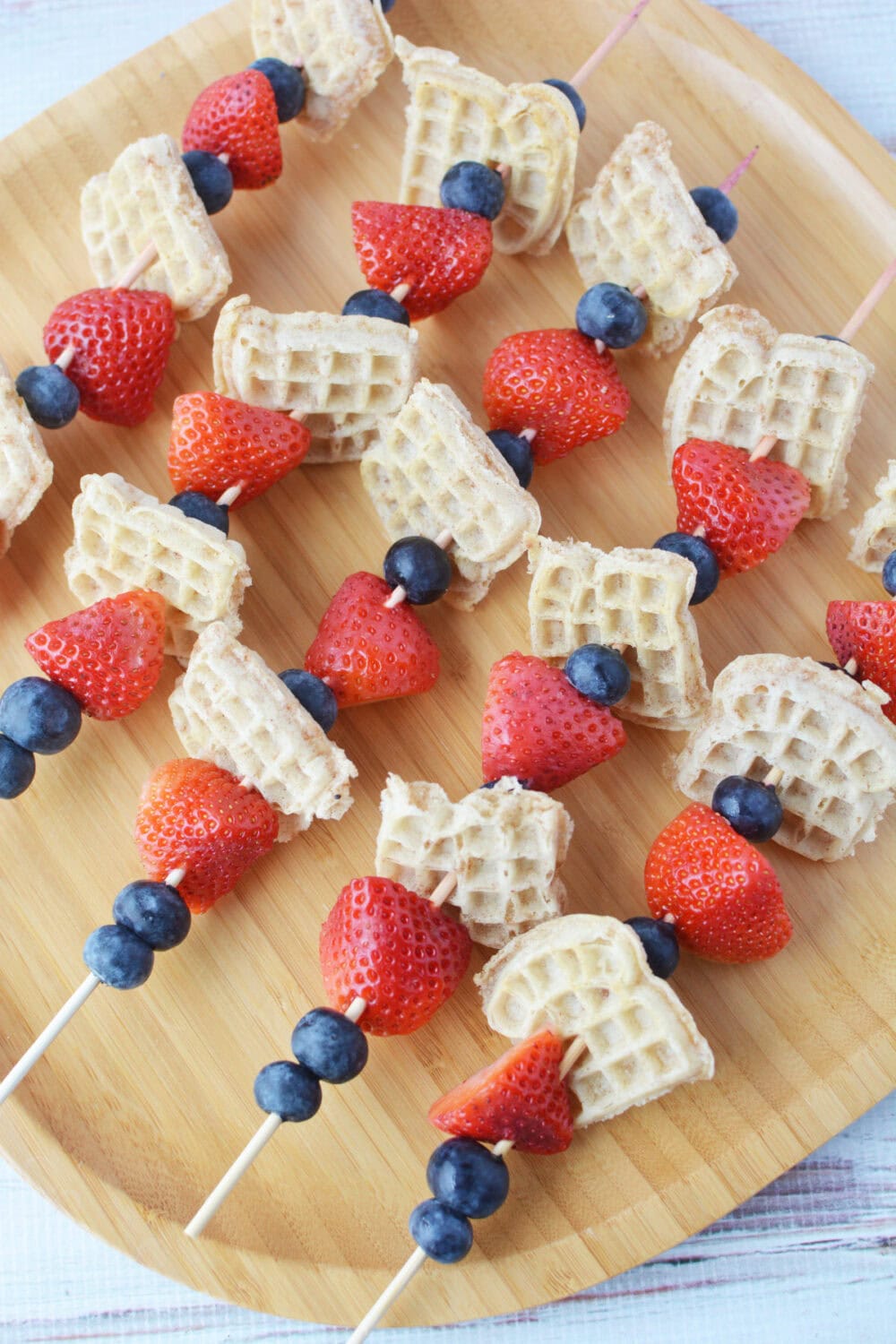 Skewered waffle kabobs on a plate.