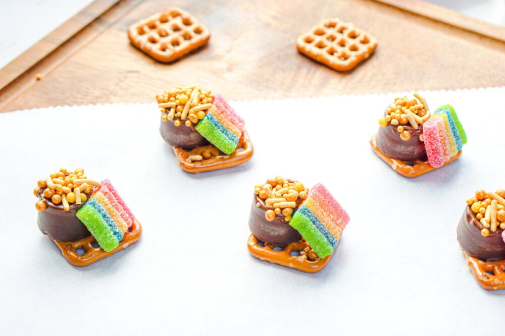 Rolo pretzel candies that look like little pots of gold with a rainbow.