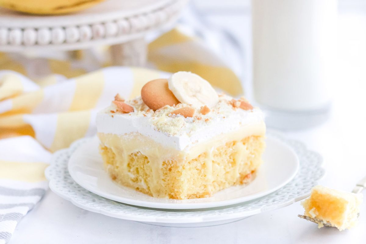 slice of banana poke cake on a plate