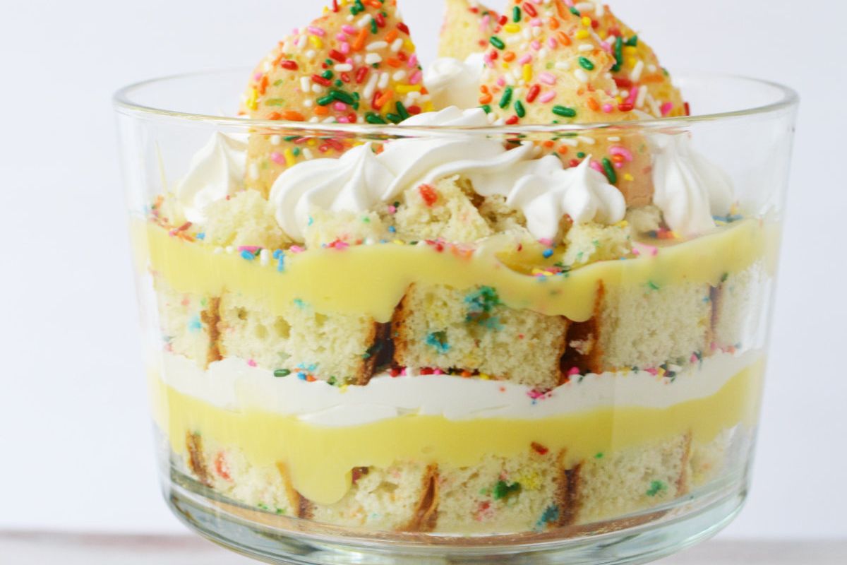 Funfetti cake layered with whipped cream and cookies