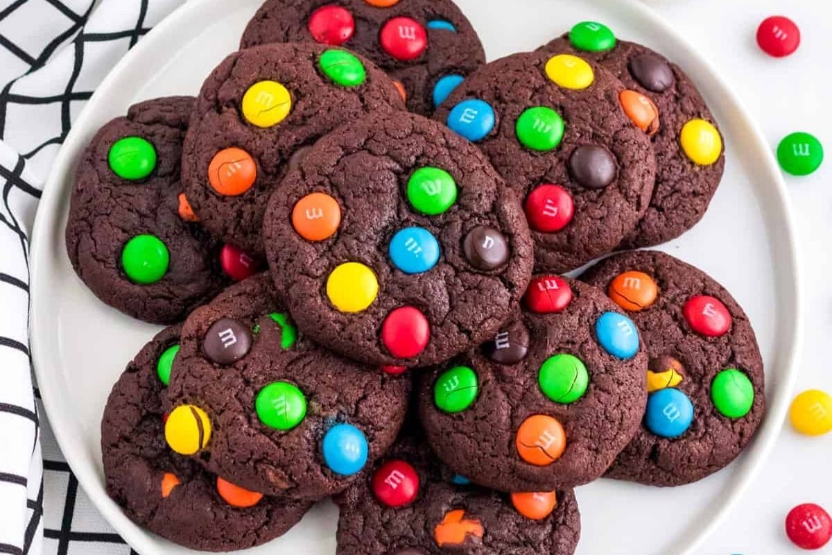 plate full of chocolate cookies with M&Ms