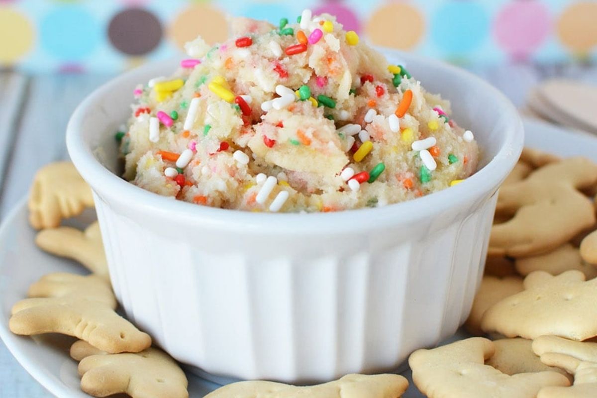 rainbow cookie dough dip surrounded by animal crackers