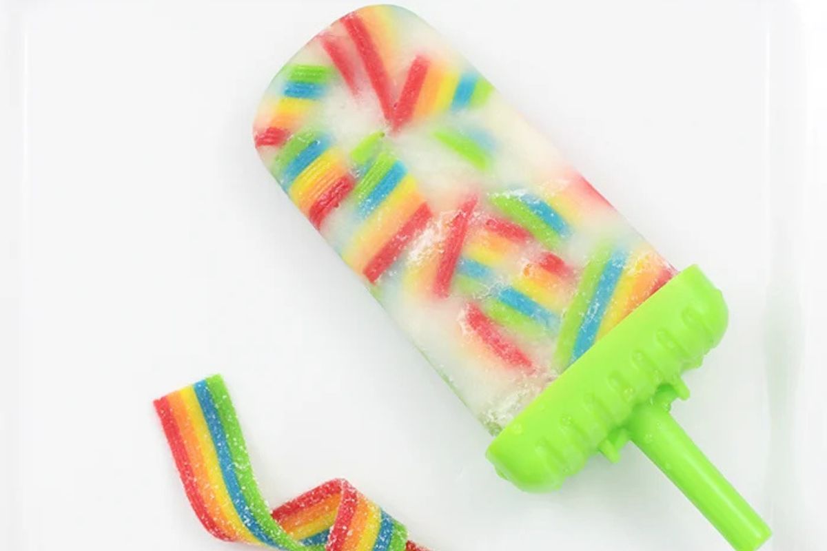 clear popsicle with rainbow gummies in it