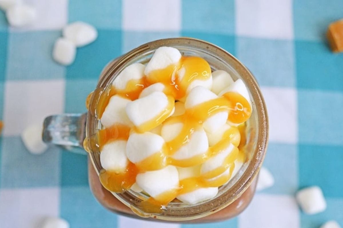 Hot chocolate topped with marshmallows and salted caramel
