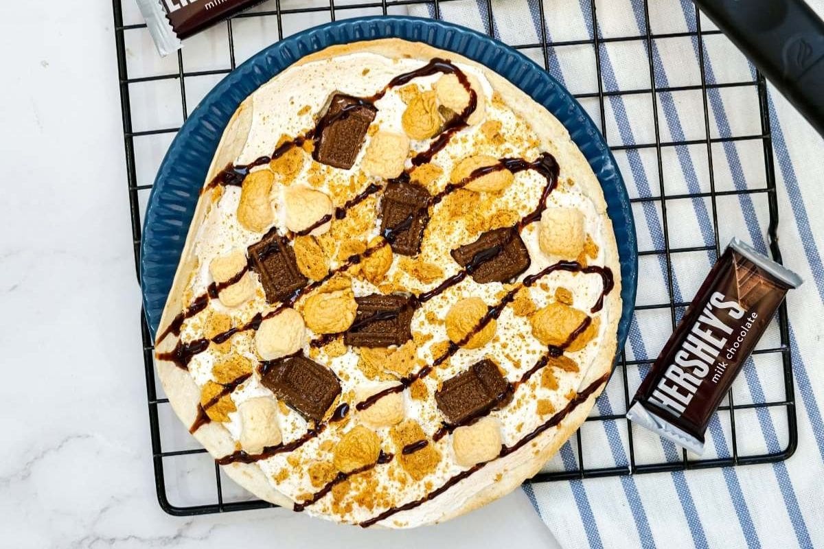 s'mores dessert pizza on a rack