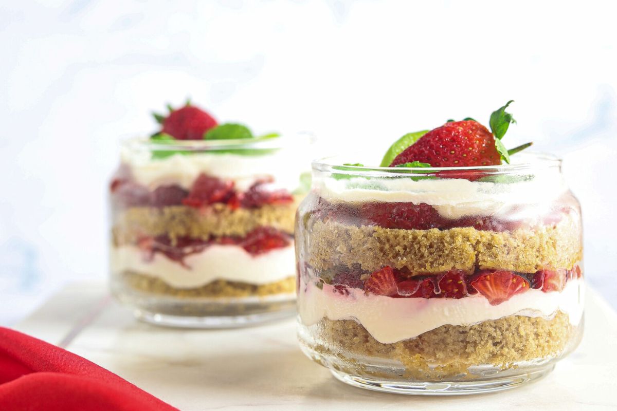 Two bowls of layered trifle dessert.