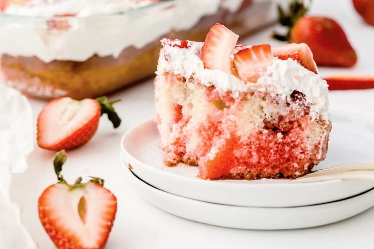 strawberry poke cake on a plate