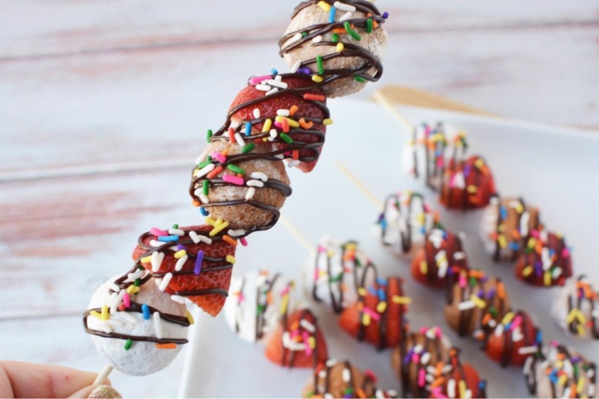 donut holes and strawberries on a skewer