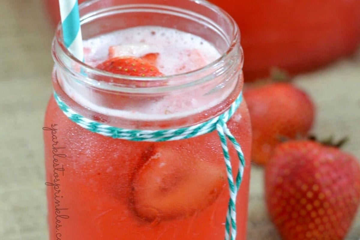 red punch in a glass with strawberries