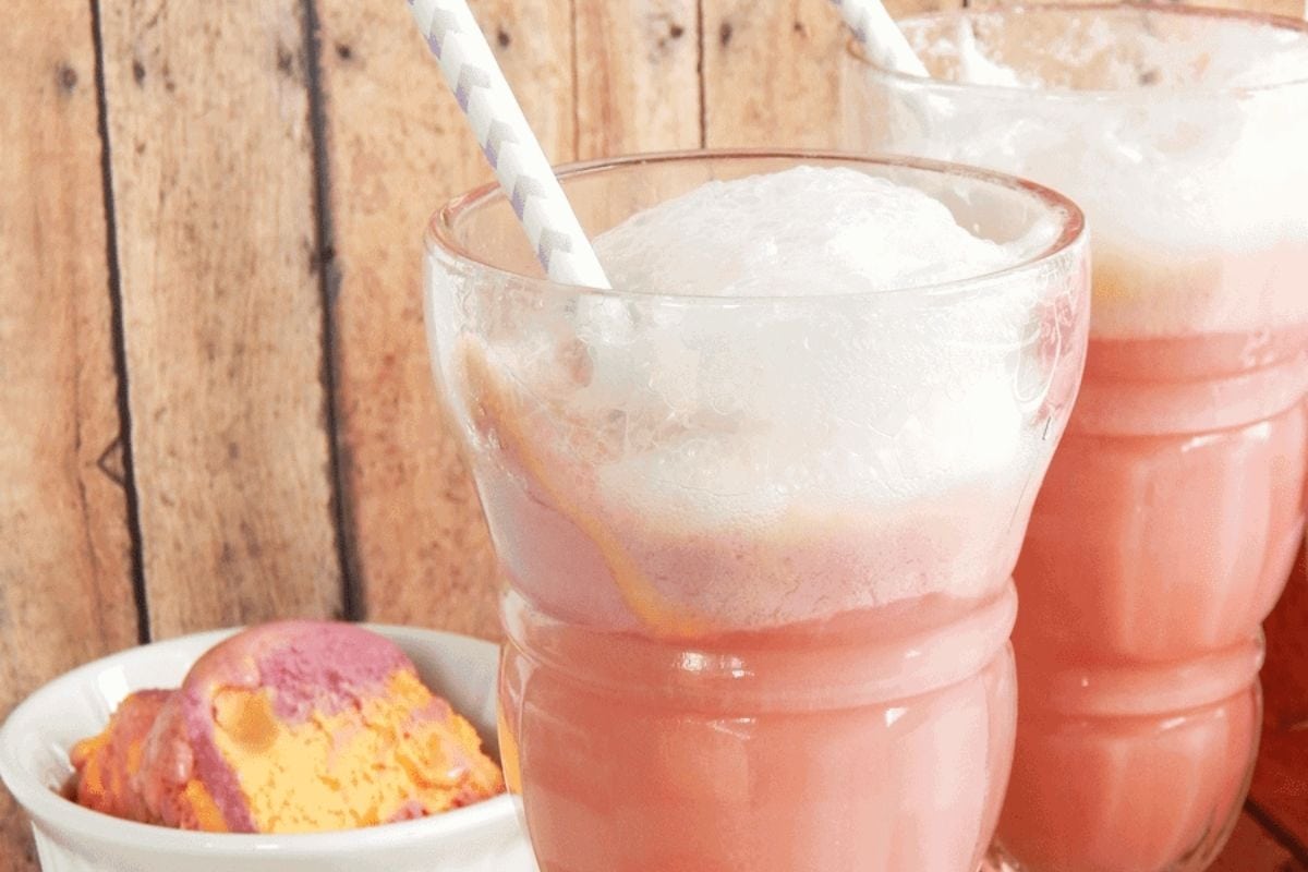 glasses of punch next to a bowl of rainbow sherbet