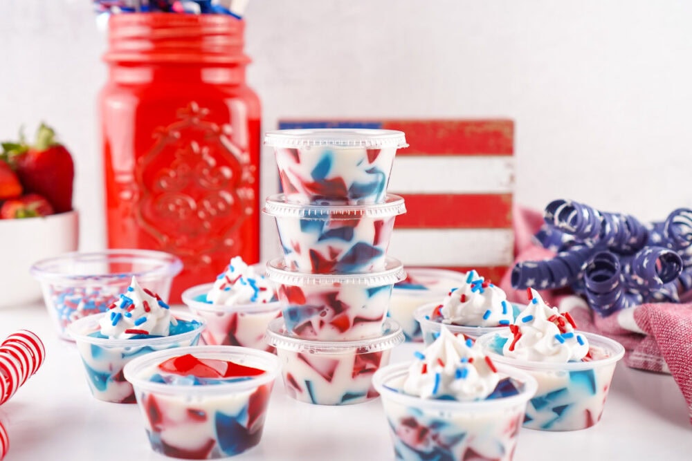 Red, white, and blue Jell-O shots in cups