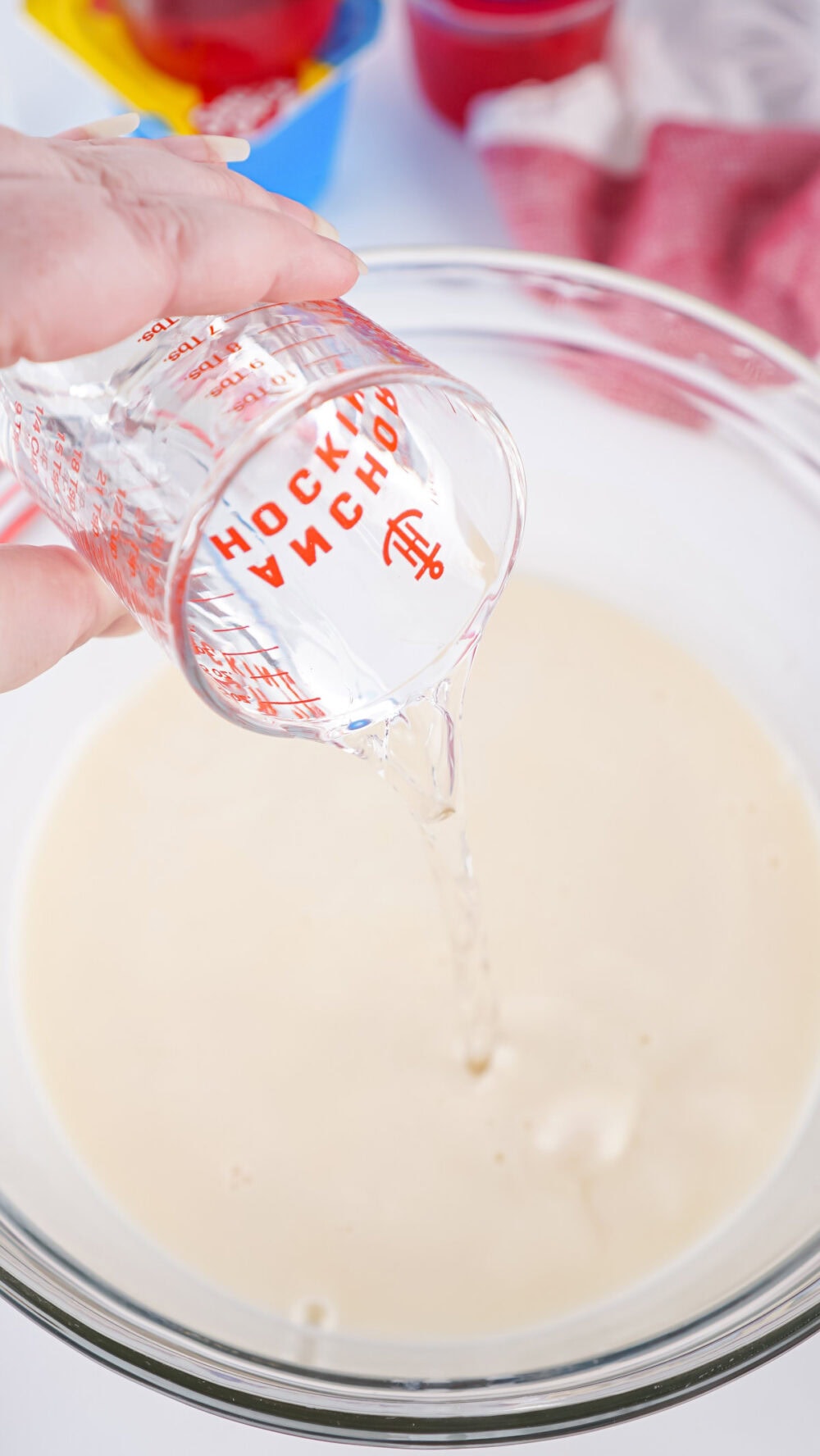 pouring liquid into sweetened condensed milk