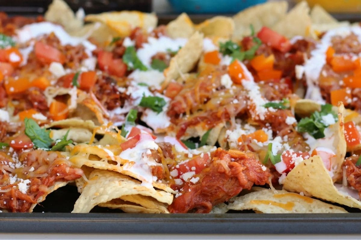 bbq nachos on a baking sheet