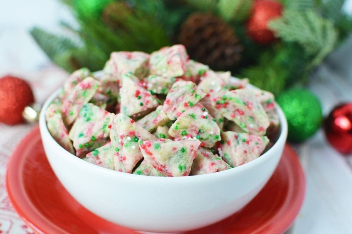 bowl full of shortbread bites with Christmas colors