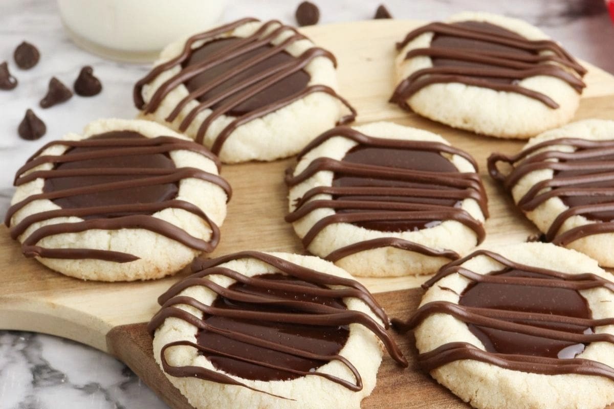 thumbprint cookies with chocolate centers and drizzle
