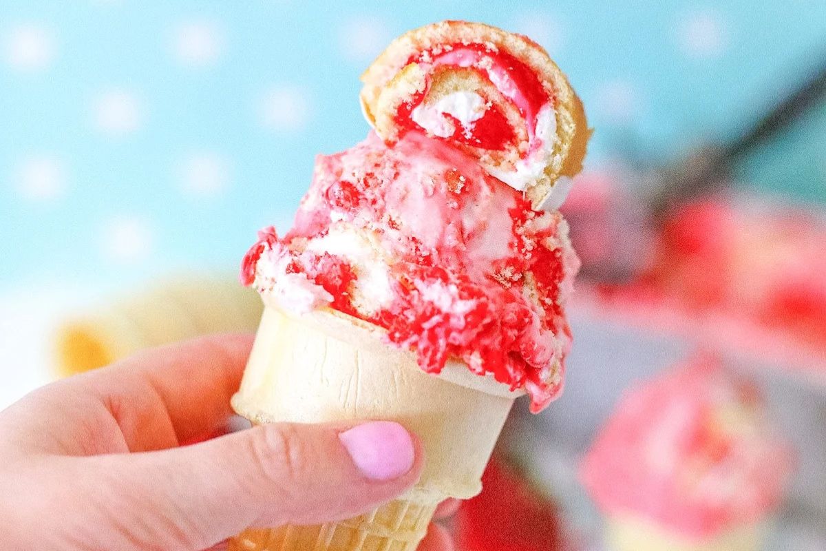 strawberry shortcake ice cream in a cone