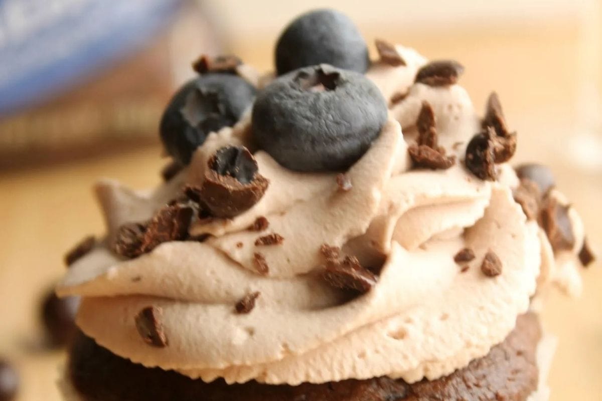 chocolate cupcake with blueberries on top